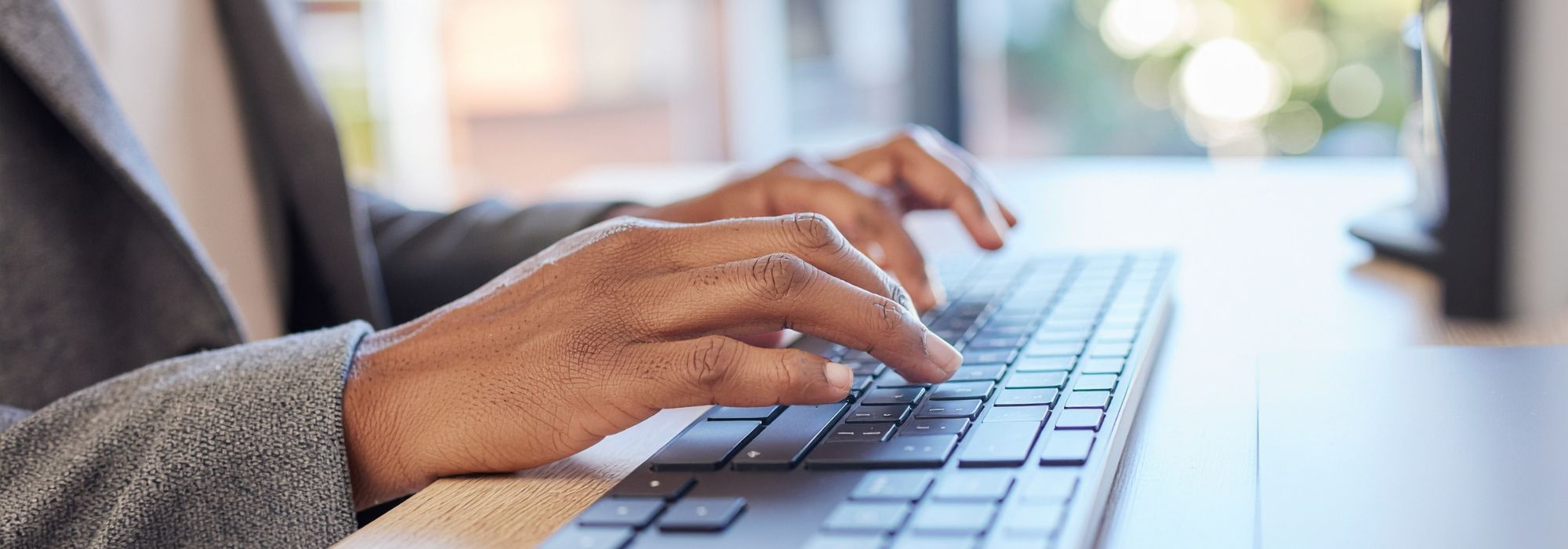 Hands typing on a Keyboard