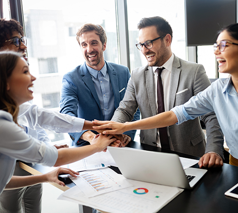 Business team celebrating a good job in the office