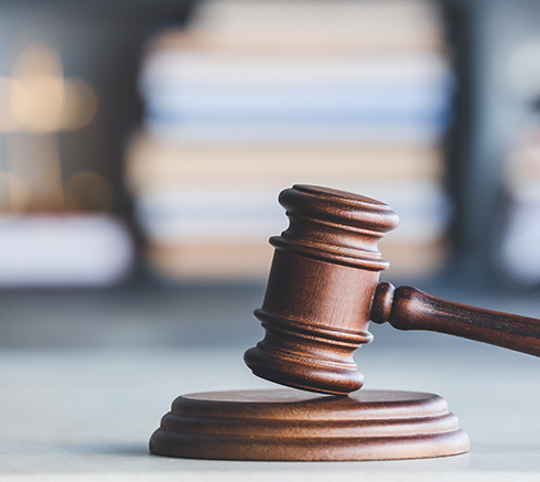 Judge's gavel on table in office