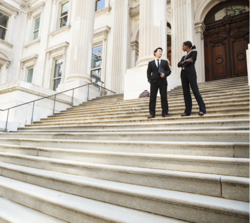 Two lawyers outside a court house