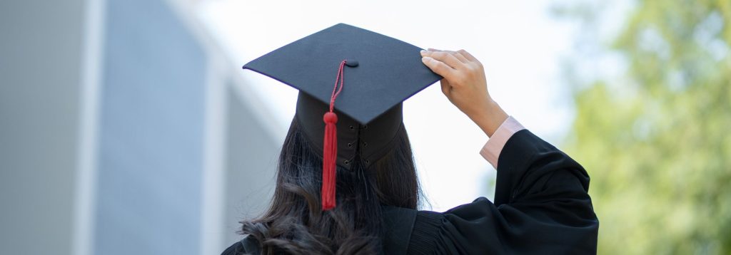 Woman in graduation robe and cap