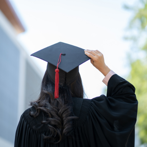 Woman in graduation robe and cap
